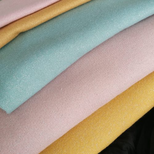 Collegekangas harjatulla taustalla glitter haaleanvihreä hopea